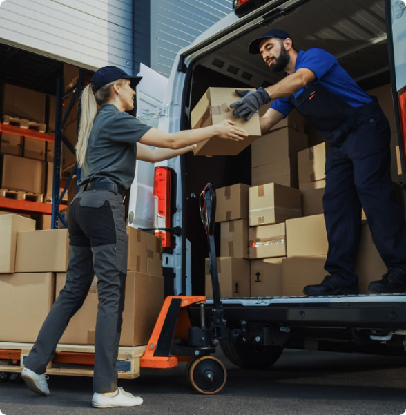 packages being unload from truck by male and female shippers